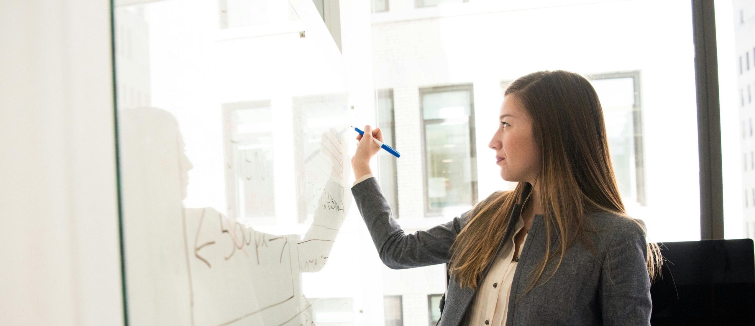 Can I be an adjunct? College adjunct professor writing on board in classroom